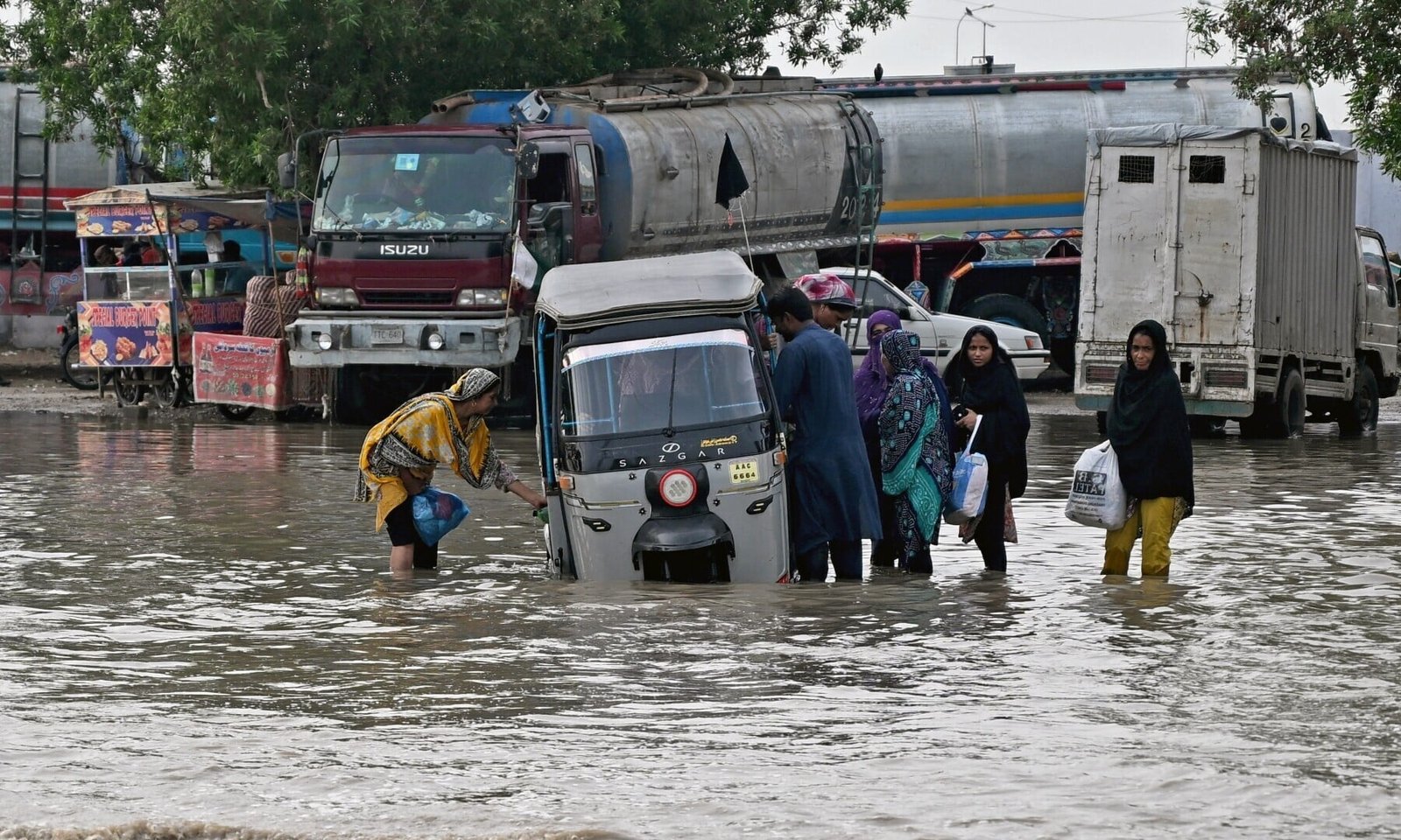 Karachi's Perennial Flooding: A Man-Made Monsoon Crisis Citizens stuck in Karachi's Urban Flood