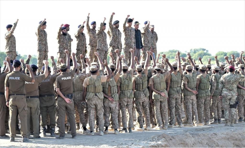 COAS Field Marshal Syed Asim Munir Reviews Flood Situation in Kasur and Multan Troops of Pakistan Armed Froces and Civil Administration (Police) gather around COAS FM Syed Asim Munir, Raising their Hands as they chant Slogans to boost morale
