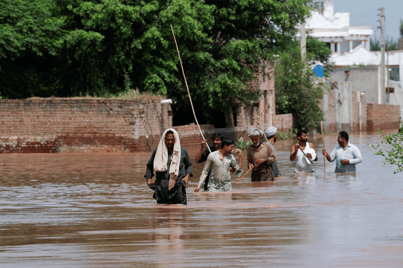 Pakistan’s Floods: A Climate Emergency Exposing Governance Fault Lines People walking among floods in Pakistan